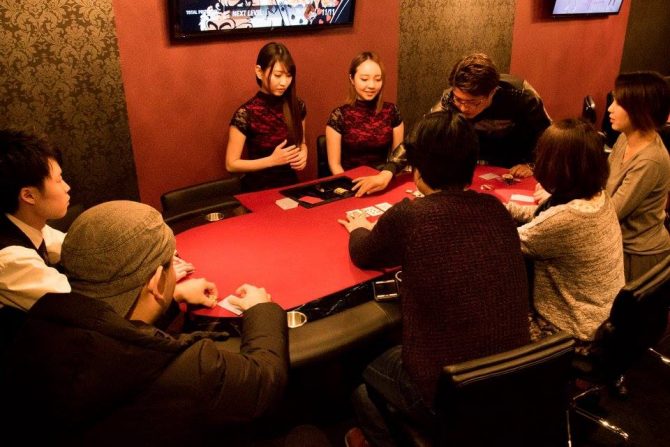 Players around the table at Hige Gorilla