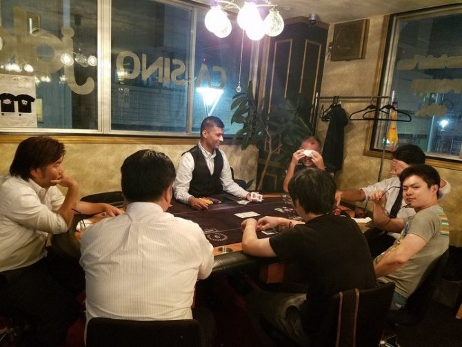 Players around a table at Tachikawa Joker Casino