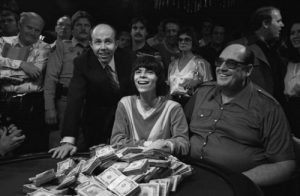Black and white photo of Stu Ungar laughing at the poker table