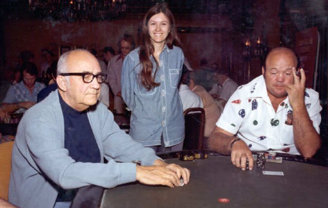 Johnny Moss sitting at the poker table