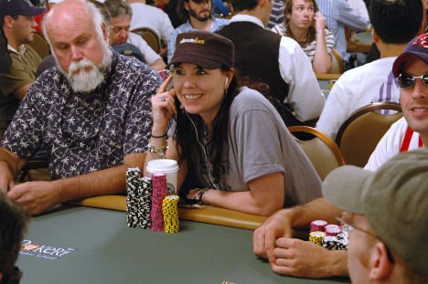 Anniee Duke smiling while playing poker