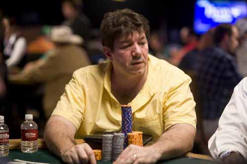 David Benyamine playing poker in a yellow shirt