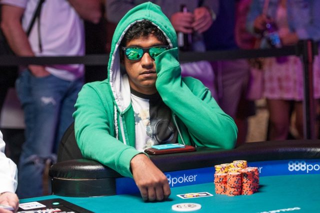 Upeshka De Silva playing poker with a green hoodie